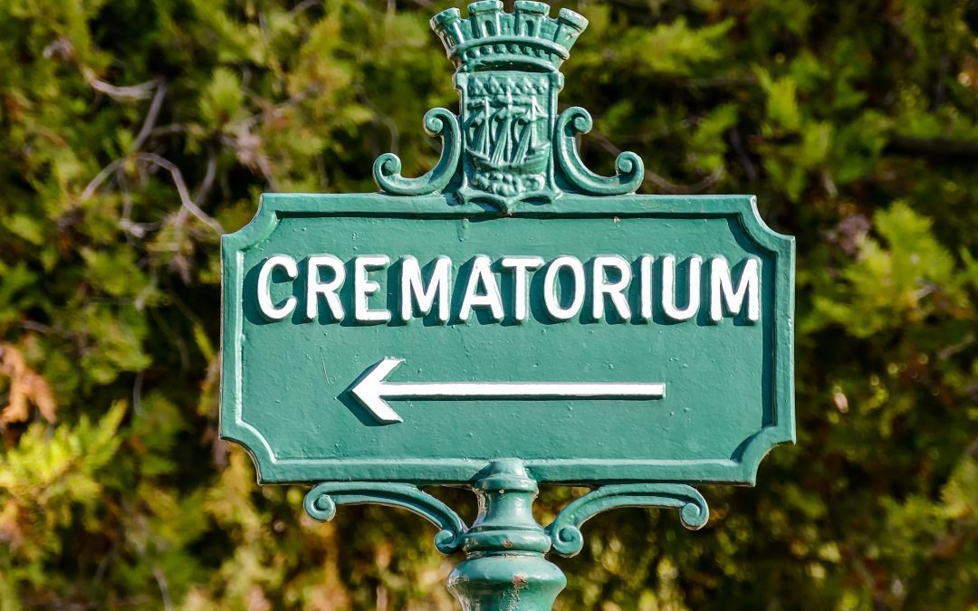 Signpost in green points to the crematorium